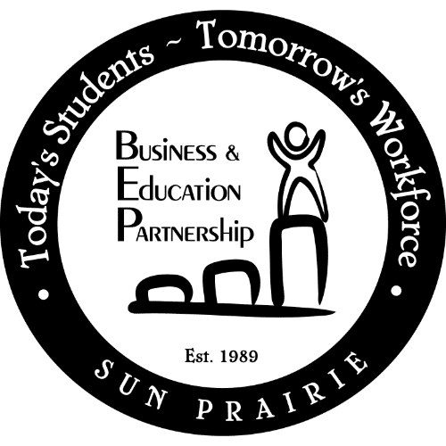 Circular logo for Sun Prairie Business & Education Partnership, featuring the text "Today's Students ~ Tomorrow's Workforce" and "Est. 1989" with a figure standing on blocks.