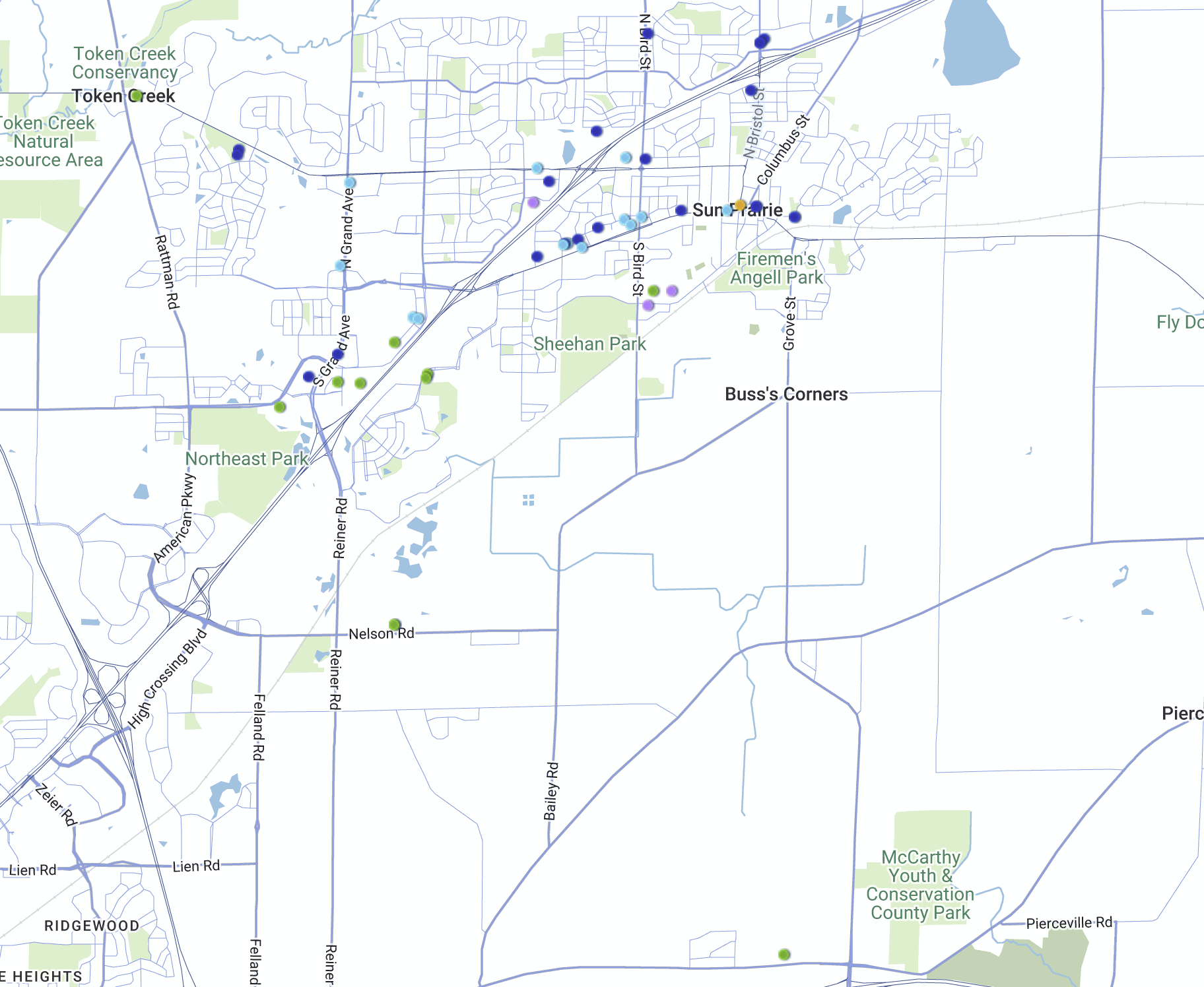 A map showing Sun Prairie, Wisconsin, with labeled parks, roads, and blue markers indicating specific locations or points of interest. Surrounding areas and conservation parks are also labeled.